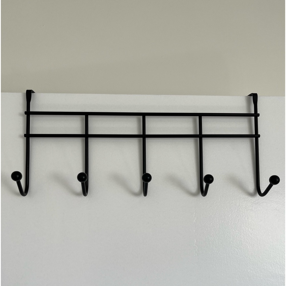 Clothes rack with 5 hooks.